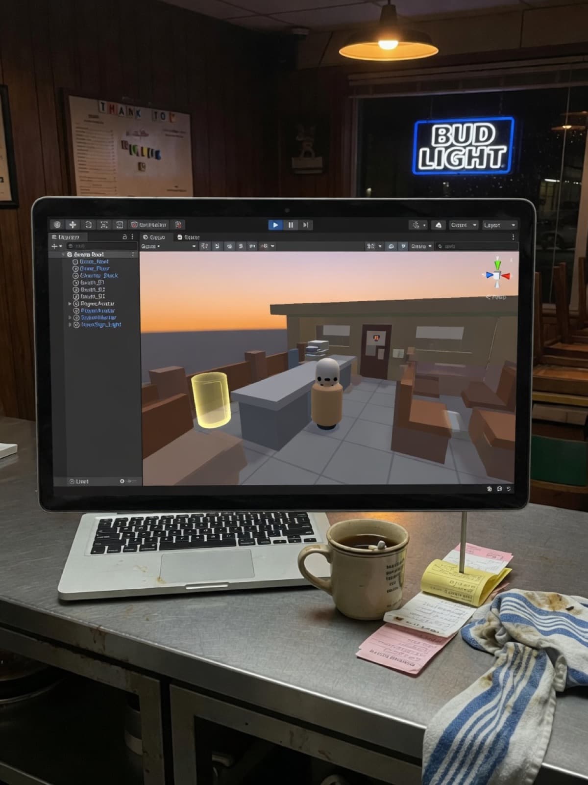 After close. A laptop on a stainless restaurant counter, the diner rebuilt as a 3D game world on screen.